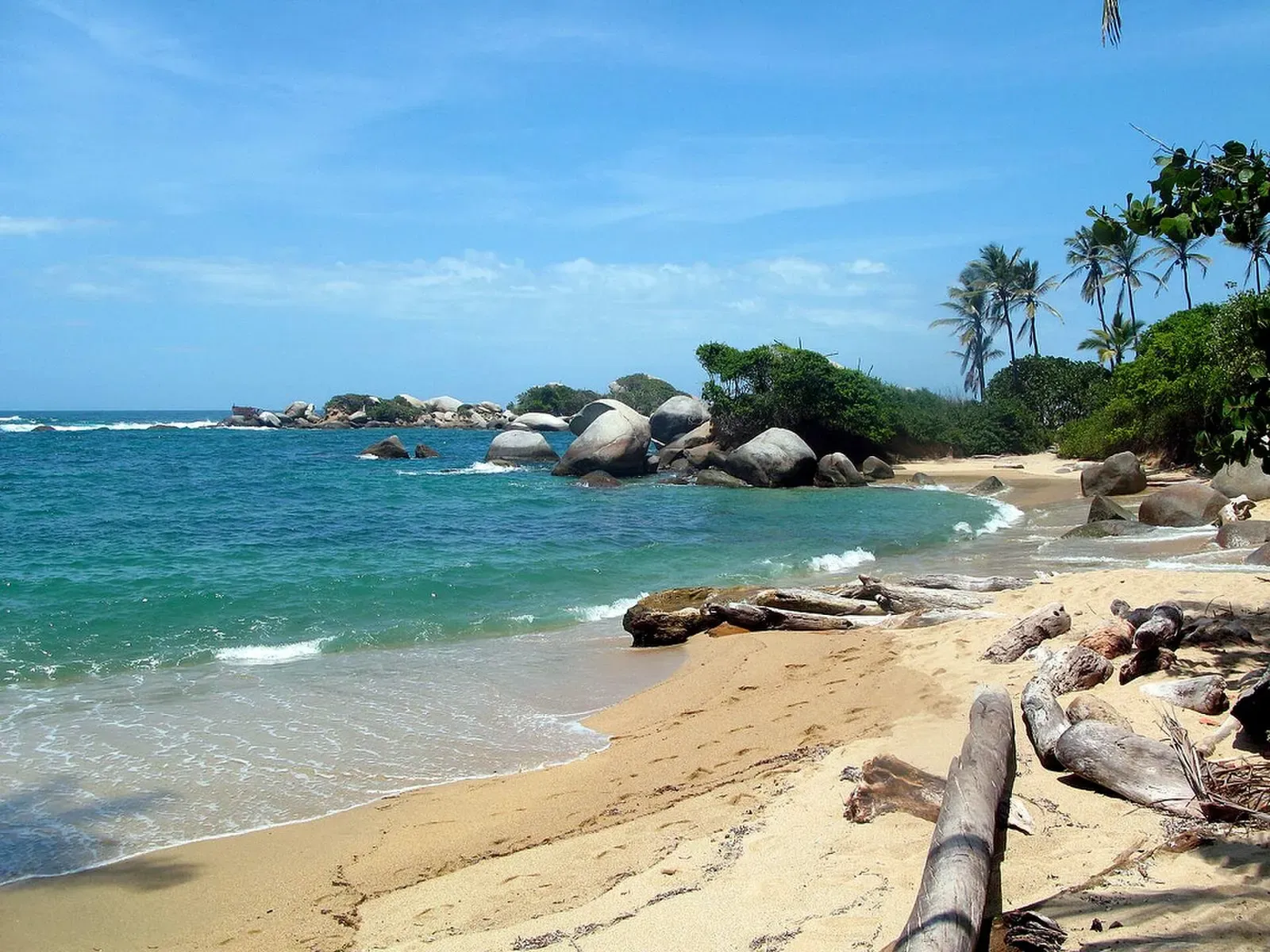Rocky point and sandy beach at Arrecifes in Tayrona National Park near Santa Marta