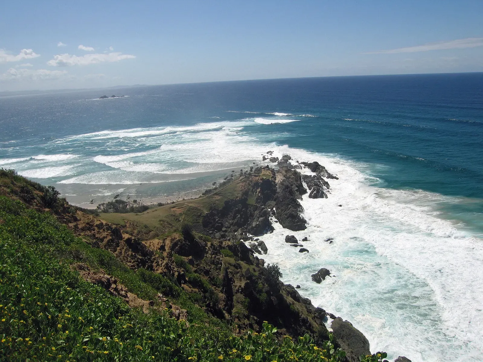 Cape Byron's rocky headland juts into the Pacific near the Julian Rocks dive site