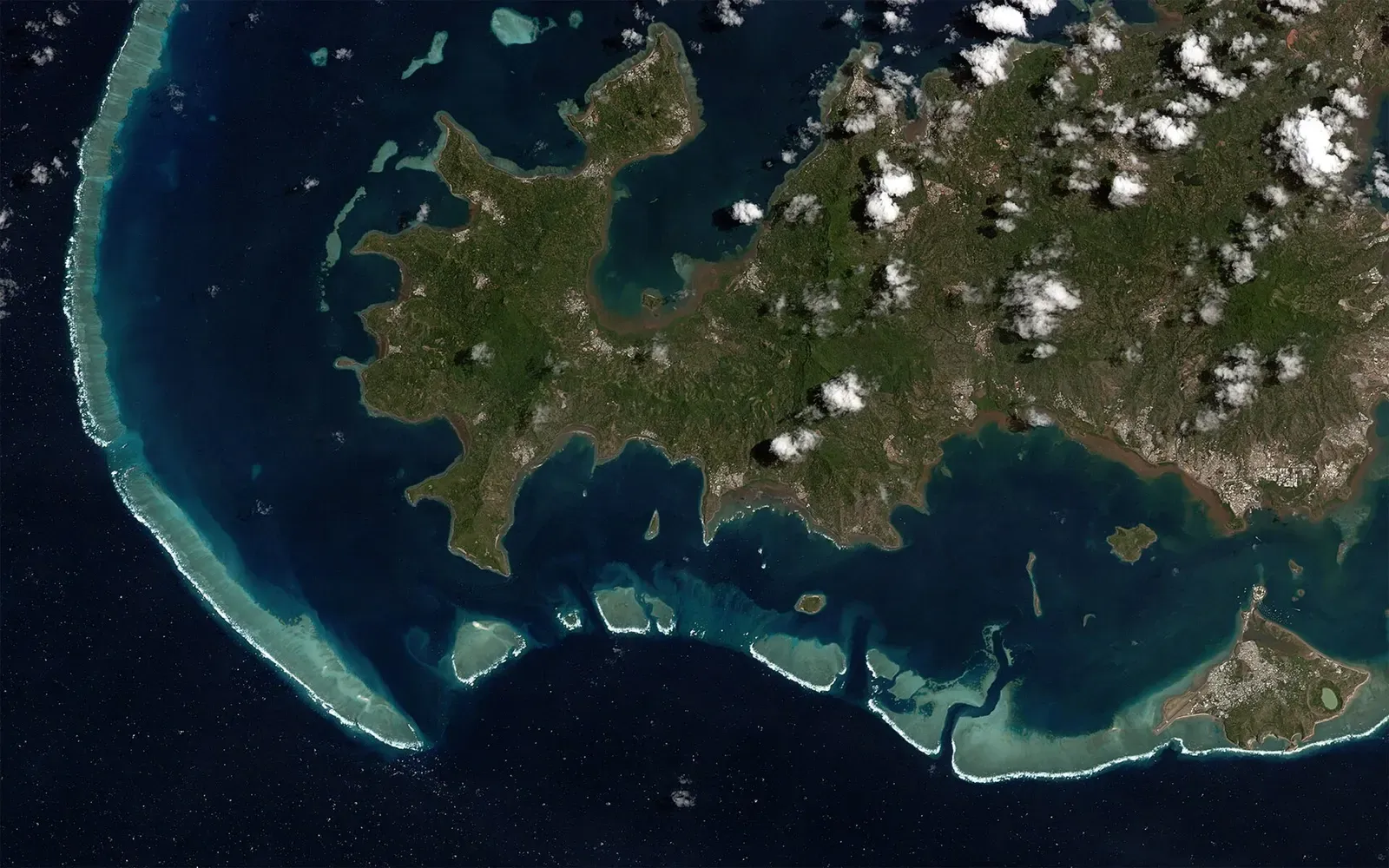 Satellite view of Mayotte's barrier reef enclosing its turquoise lagoon