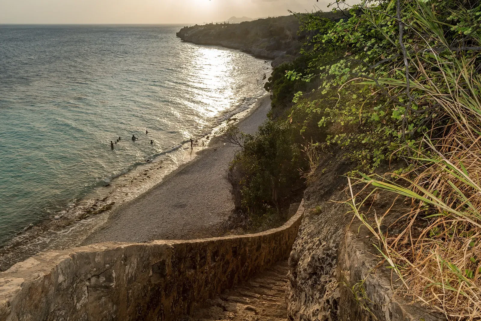 Steps lead down a cliffside to the beach entry at Curaçao's 1000 Steps dive site