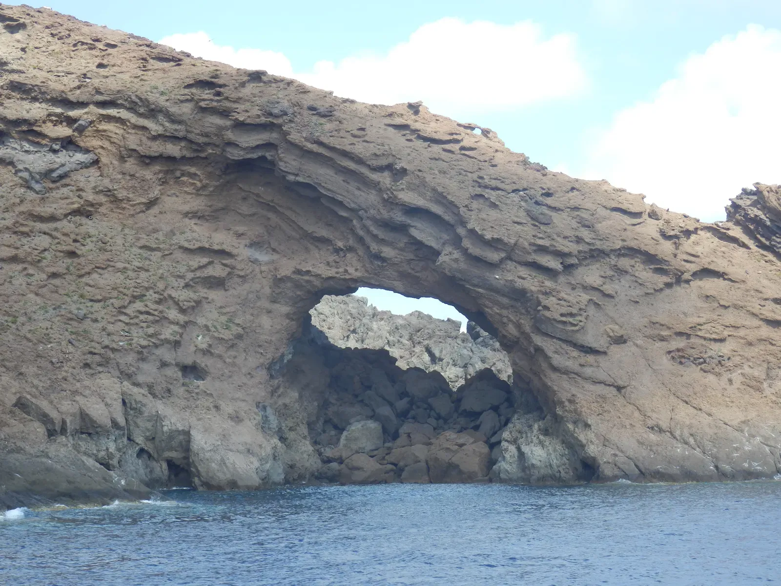 Natural arch cut through the volcanic rock of a Columbretes islet