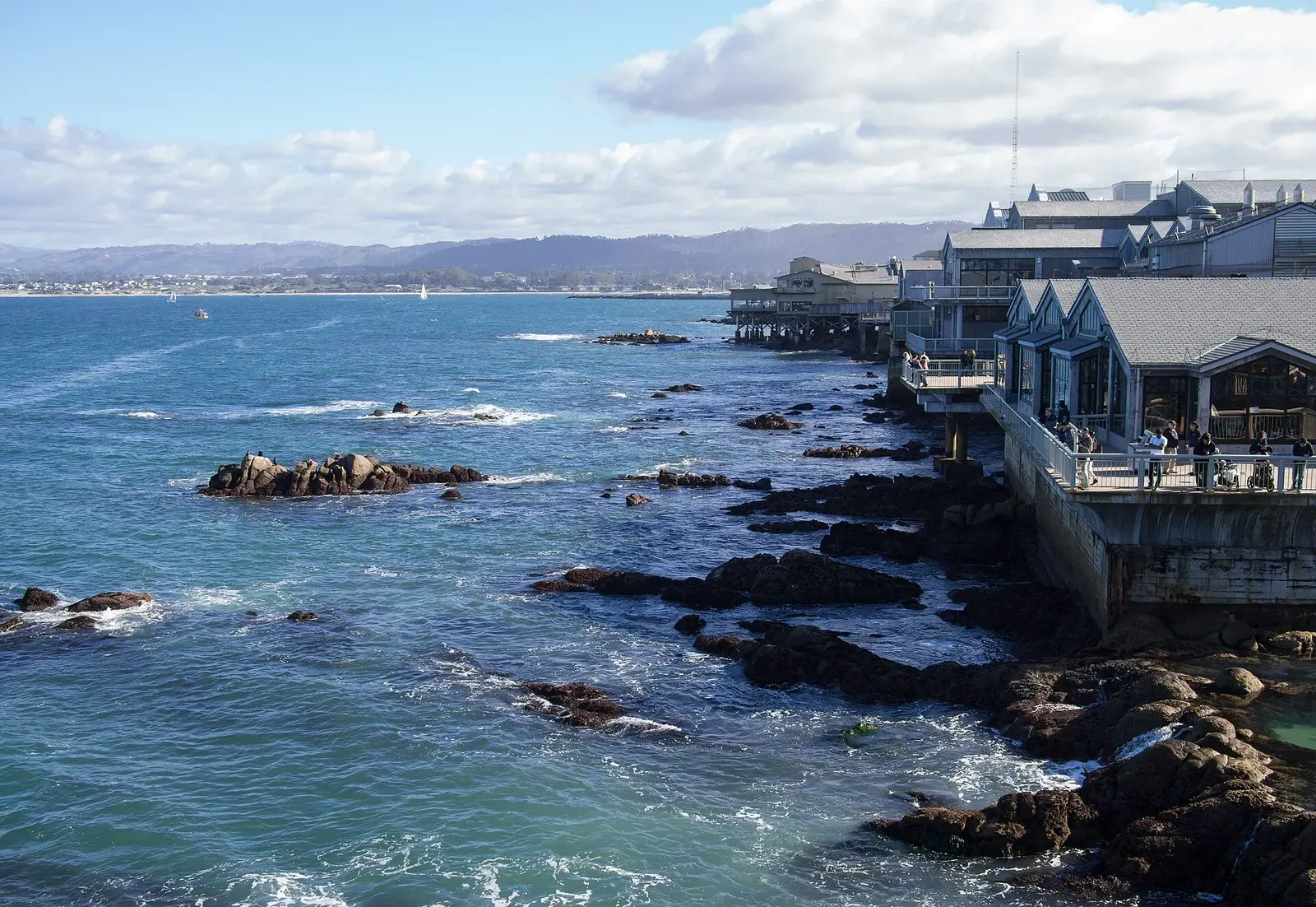 Rocky shoreline near Cannery Row overlooking Monterey Bay's waters