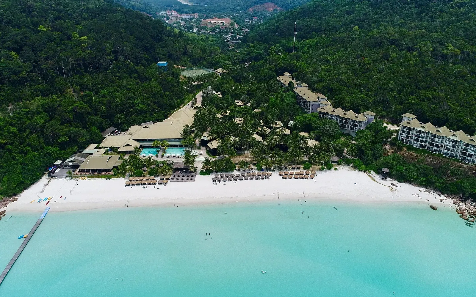 Aerial view of a resort beach lagoon on Redang Island with turquoise water and white sand.