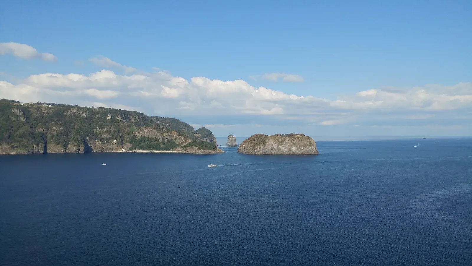 Gwaneumdo islet and its rocky sea stack rising from the East Sea off Ulleungdo's northern coast.