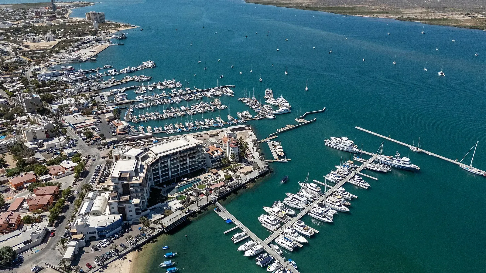 Aerial view of La Paz's marina and waterfront resort on the turquoise Sea of Cortez, Baja California Sur, Mexico.