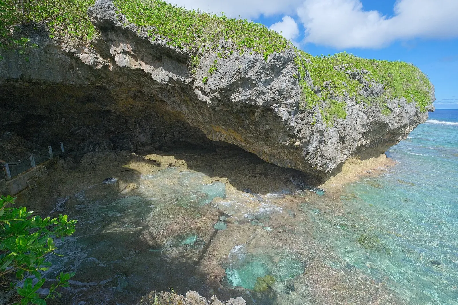 Turquoise tidal cove at the entrance to Vaila Cave on Niue
