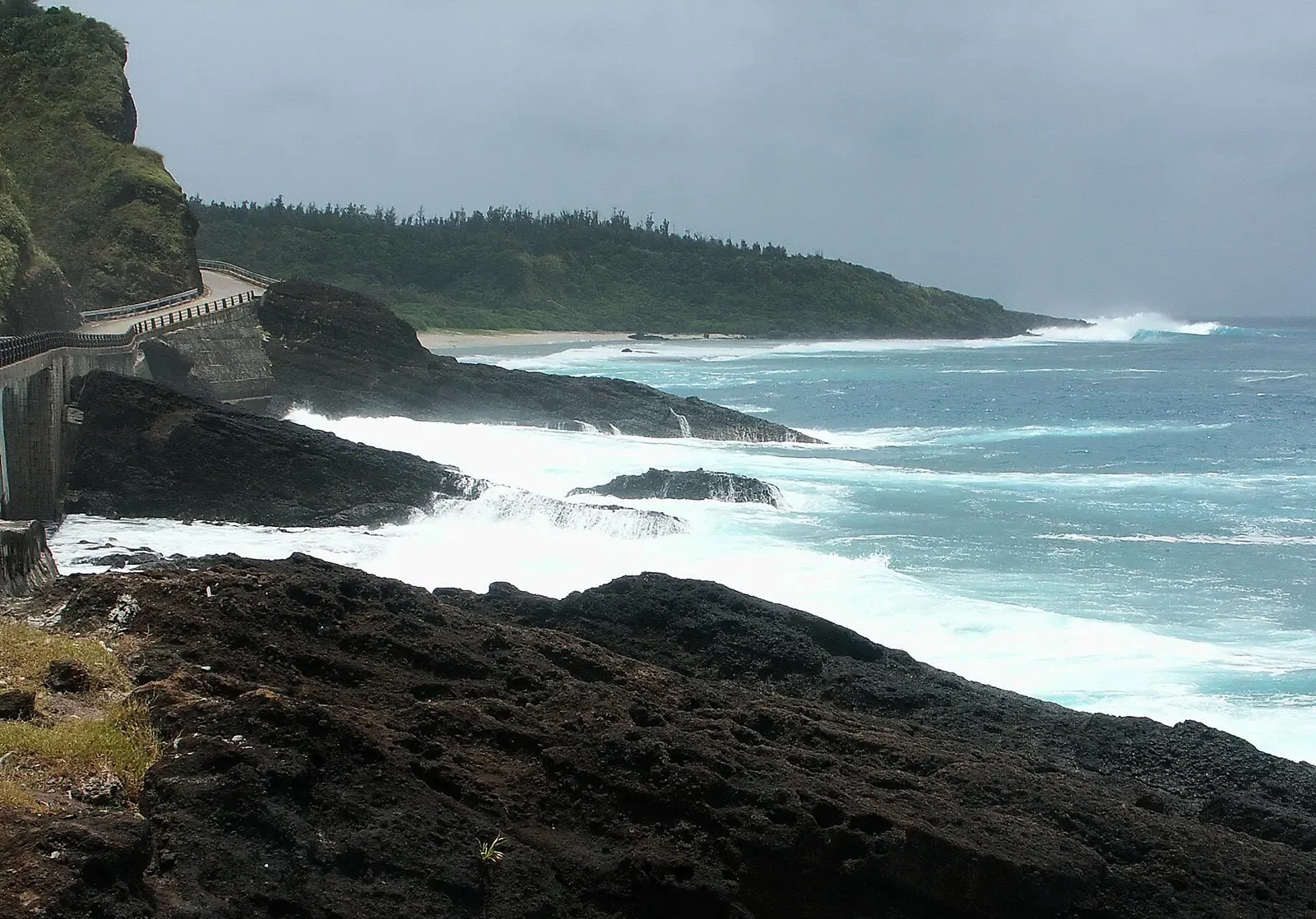 Coastal cove with breaking surf near Baisha on Green Island