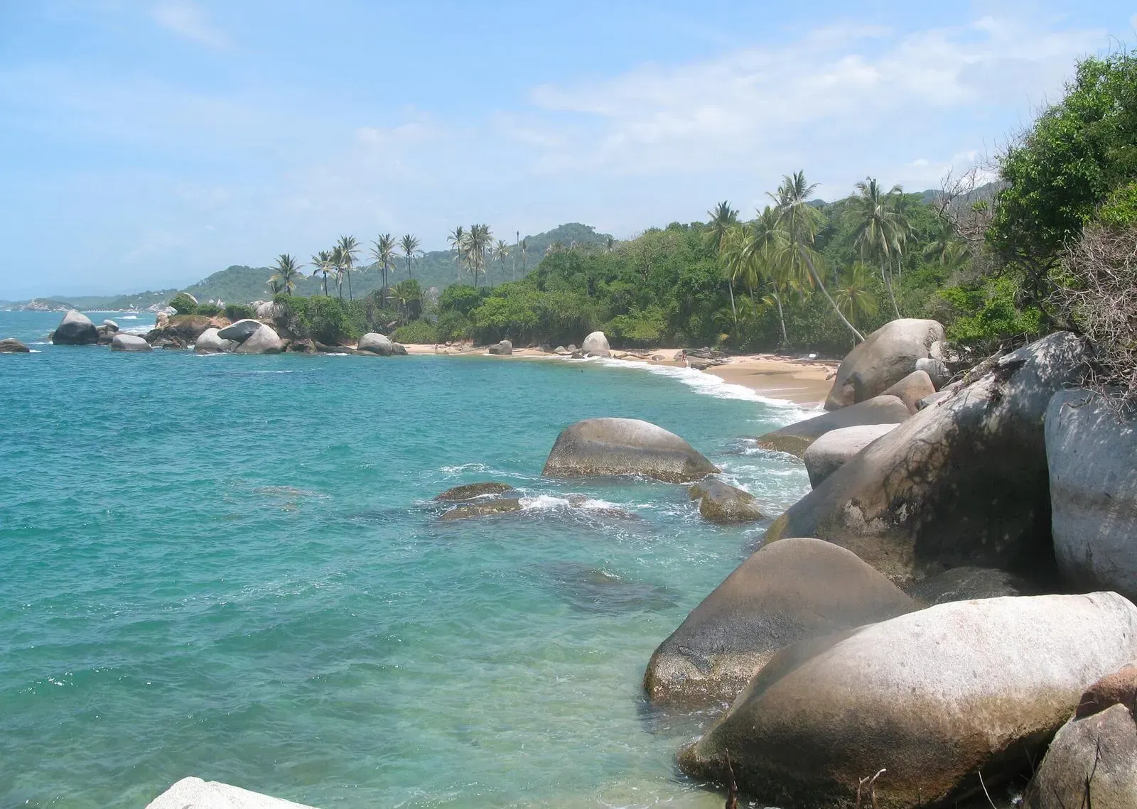 Granite boulders and turquoise water along the Tayrona National Park coastline near Santa Marta