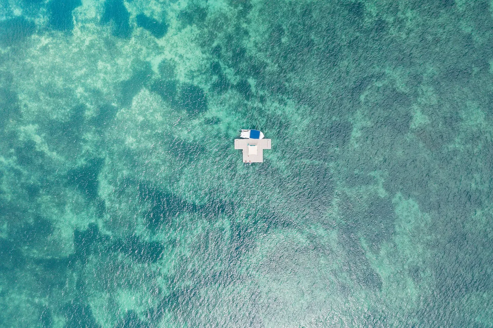 Aerial view of a diving platform floating over the coral reef near Trou aux Biches, Mauritius
