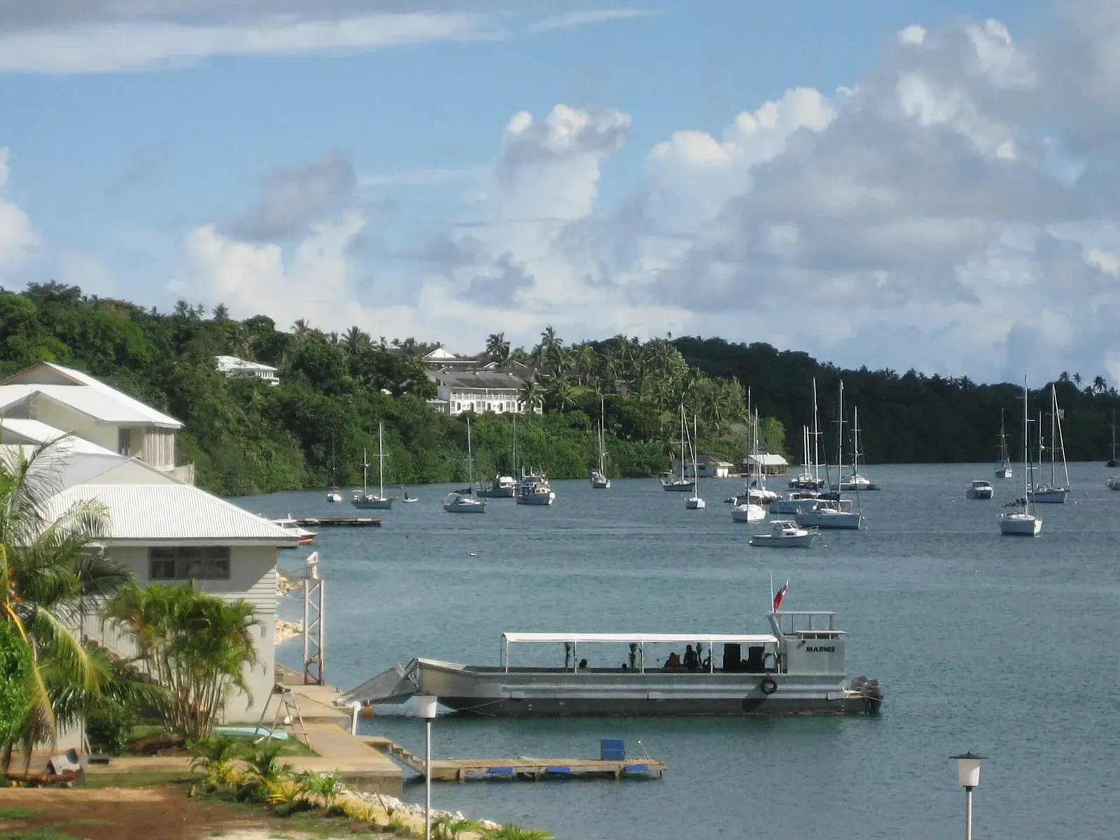 Dive boat docked at the Bounty Bar waterfront overlooking Neiafu harbour