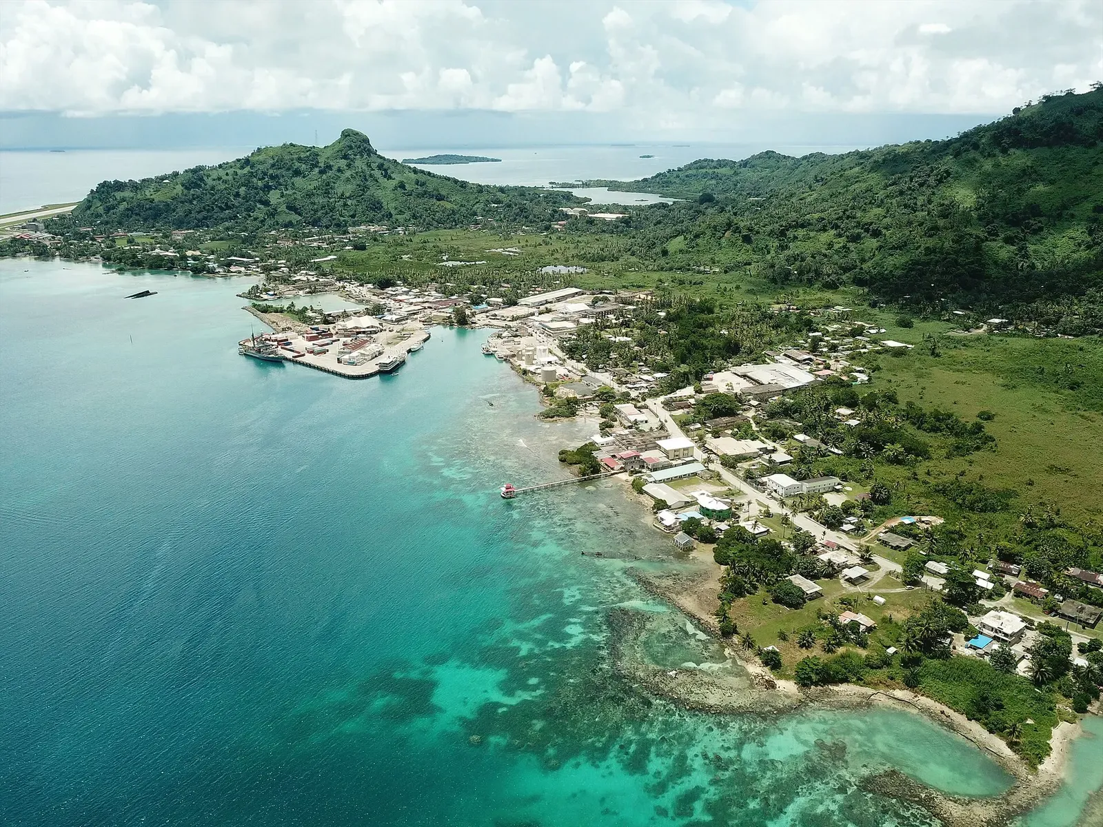 Aerial view of Weno island's harbor and coastline along Chuuk Lagoon