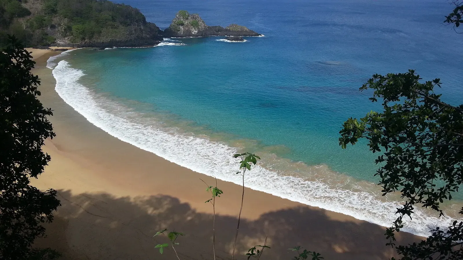 Turquoise water and white sand at Baía do Sancho, one of Fernando de Noronha's sheltered coves