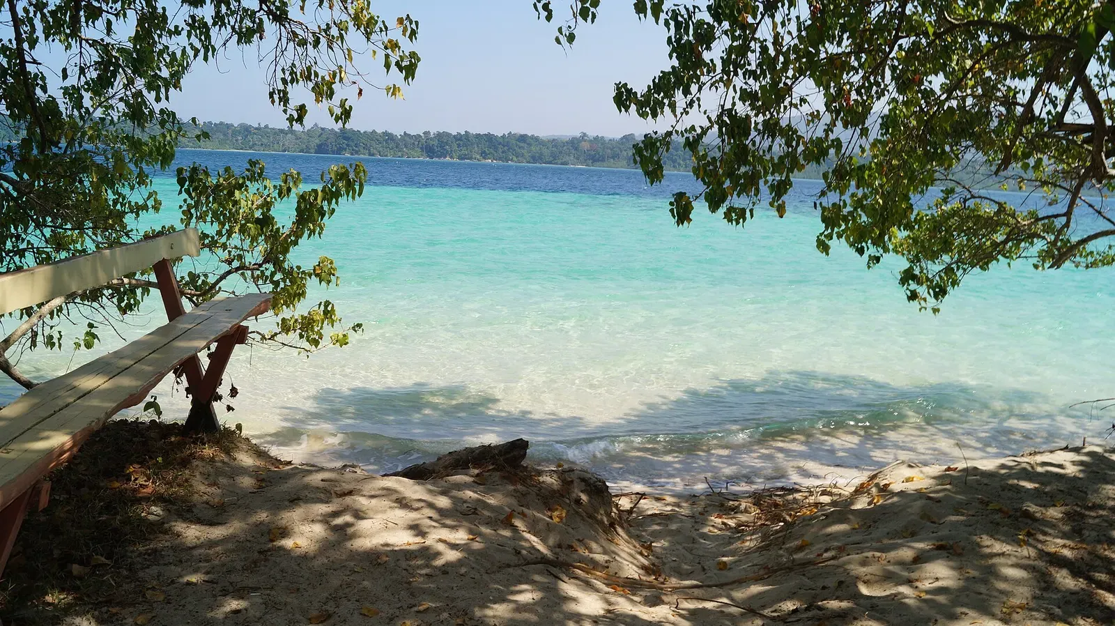 Turquoise shallows and forested shoreline at Jolly Buoy Island in the Andaman Islands