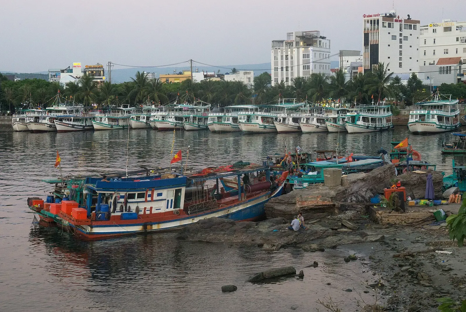 Tourist and fishing boats moored in a harbor at dusk near Duong Dong, Phu Quoc