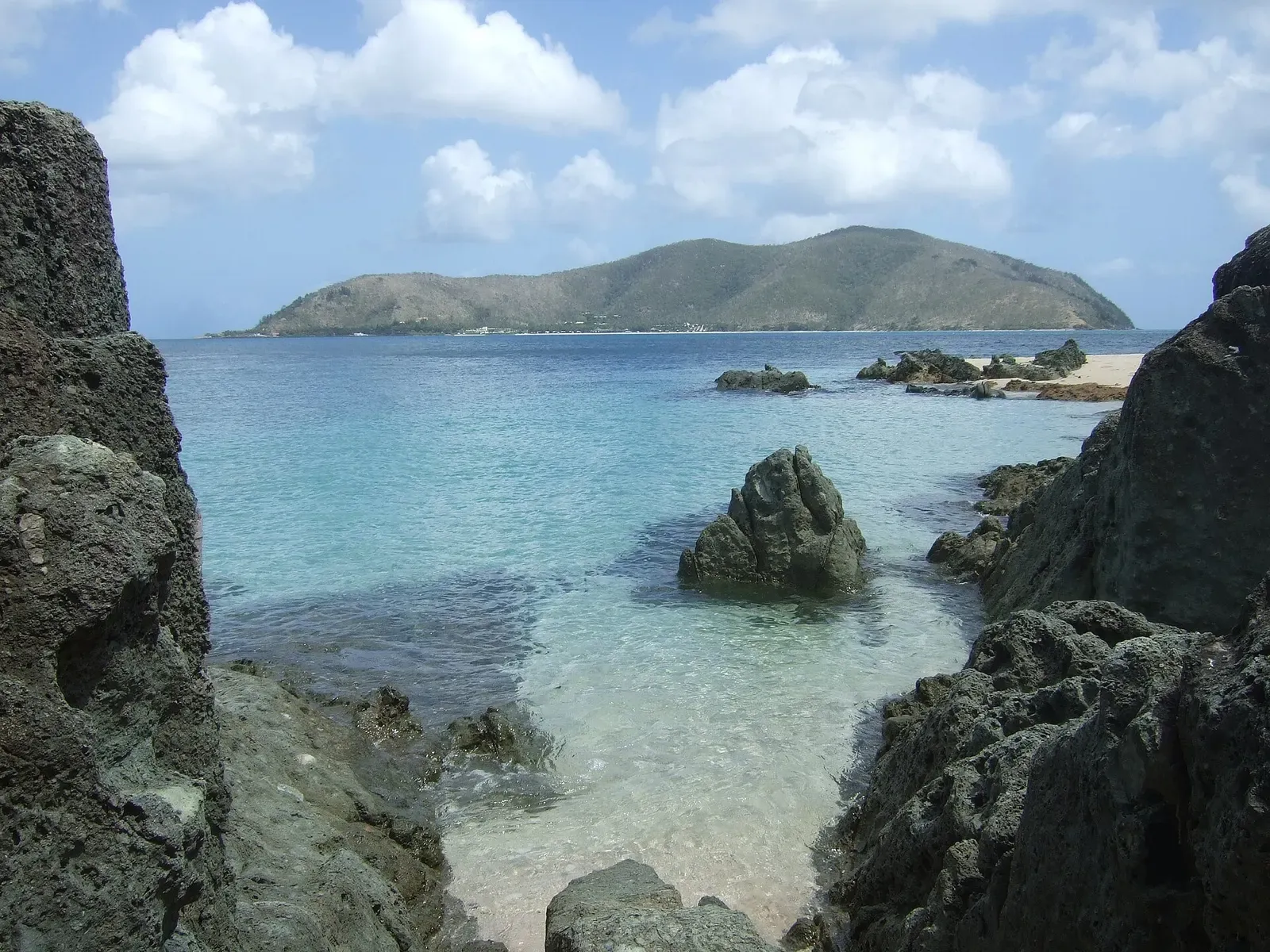 Rocky shoreline and turquoise bay at Black Island in the Whitsundays