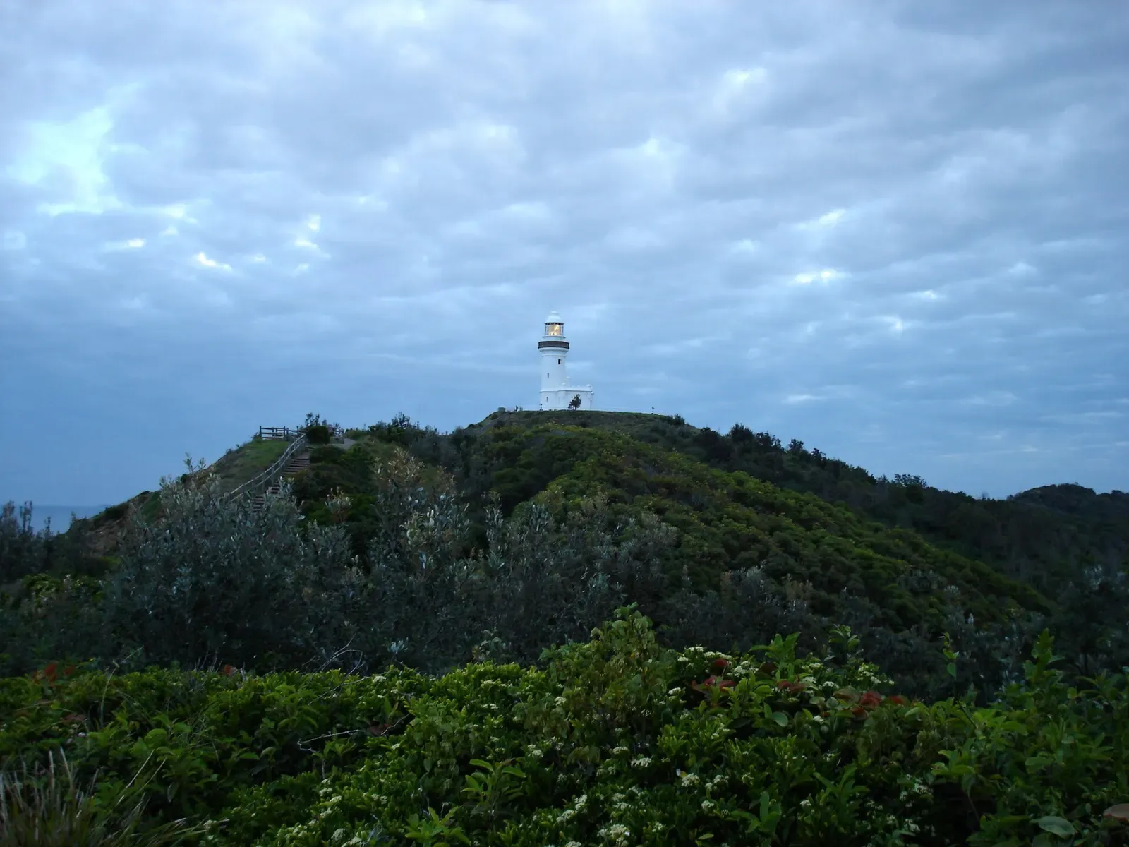 Green headland near Cape Byron lighthouse, overlooking the waters off Julian Rocks