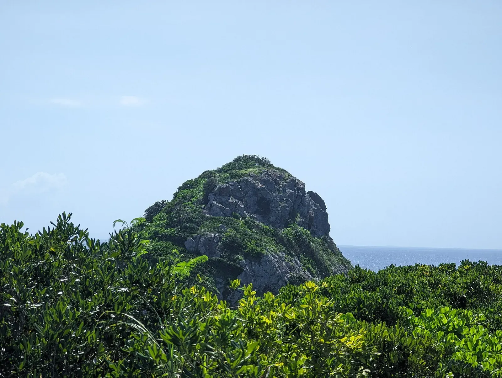 A rocky headland juts into the sea at Kabiraishi-zaki on Ishigaki's north shore.