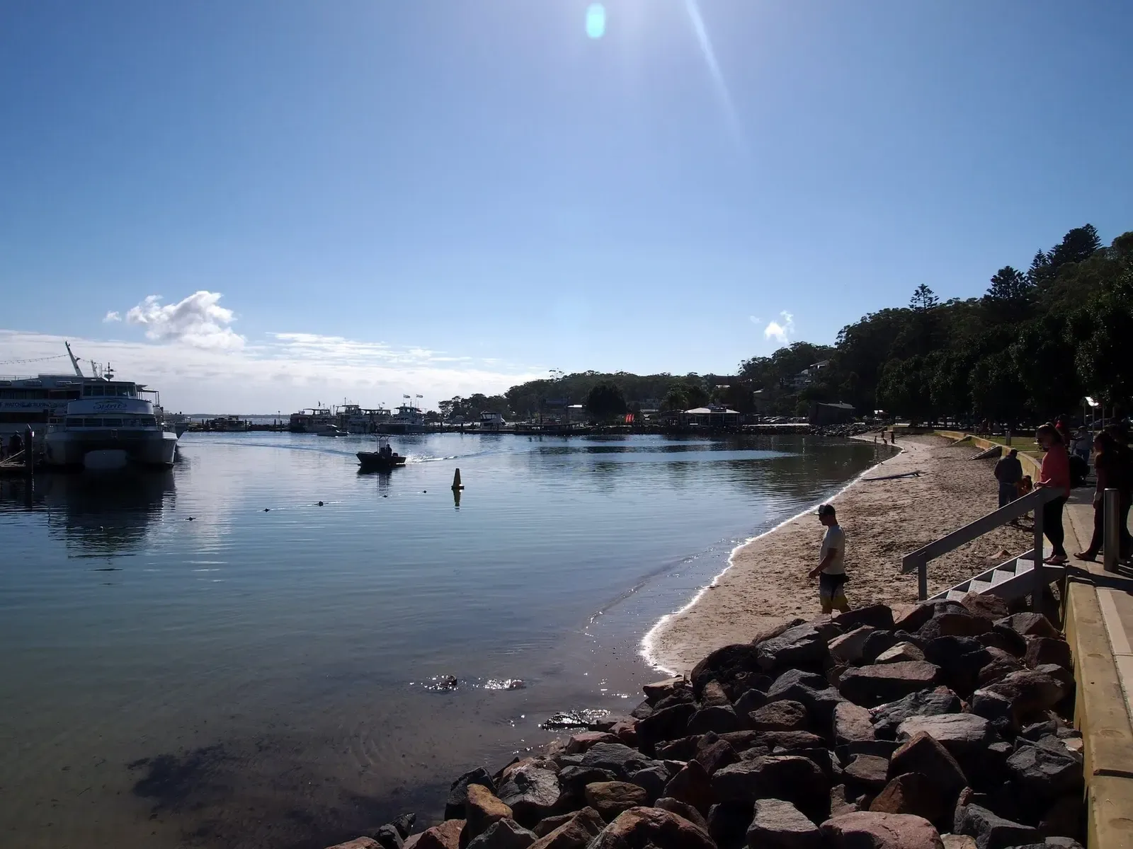 Morning light over Nelson Bay's rocky point and calm harbour waters near Port Stephens