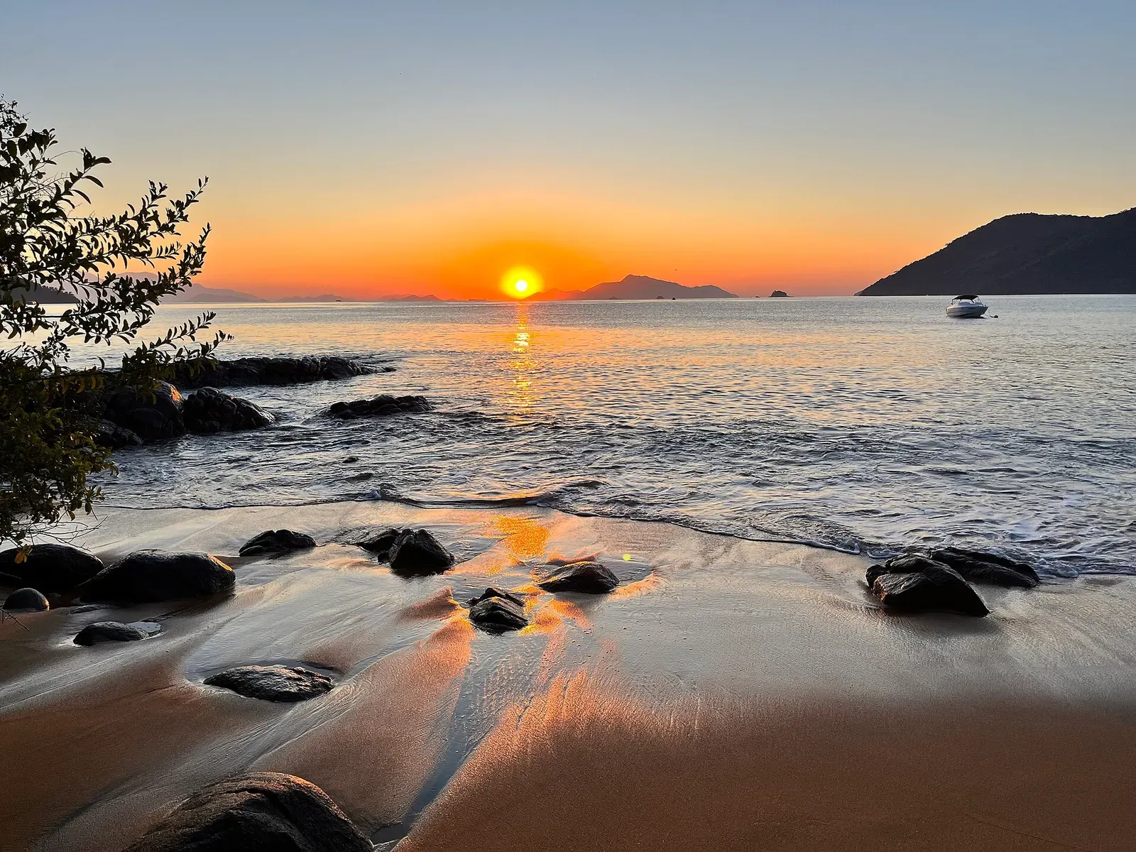 Sunrise over the water at Praia do Perequê on Ilha Grande, Brazil